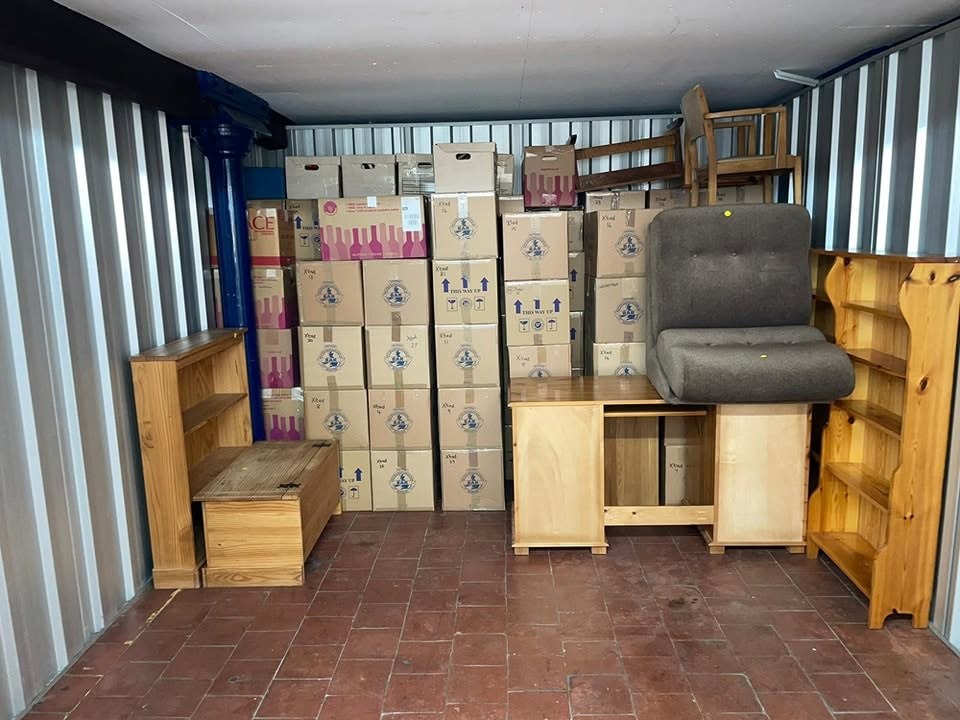 Furniture and boxes in KC Removal Solutions storage unit