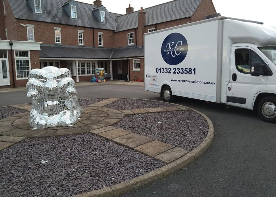 KC Removal Solutions van with mirrored sculpture